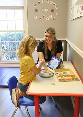 Image of session at Small Steps Pediatric Therapy with Clinician and Patient
